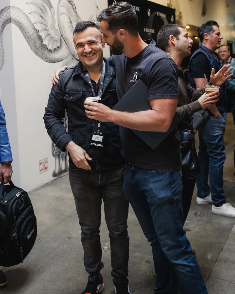 Jordan Ross, founder of 8 Figure Agency, with a client at the 8 Figure Live event